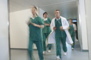 Doctors Running in Hospital Corridor